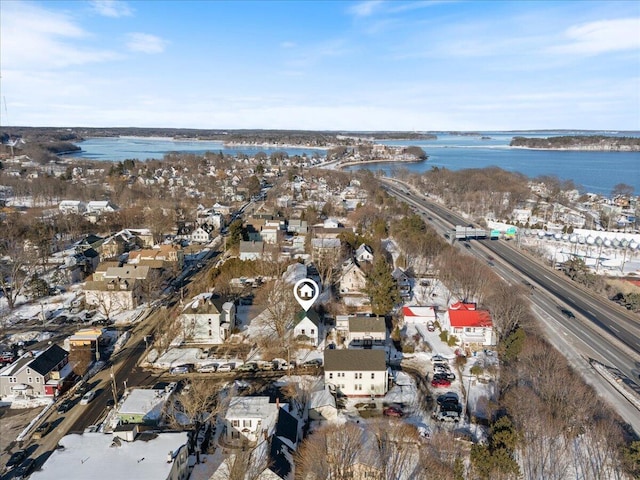 drone / aerial view with a water view and a residential view