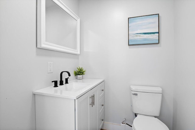 half bath with toilet and vanity