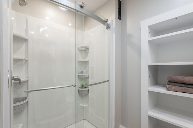 bathroom with a shower stall