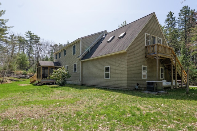 27 Libby Ln, Brunswick, ME 04011 - rear view of property featuring a sunroom, cooling unit, a wooden deck, a yard, and stairs