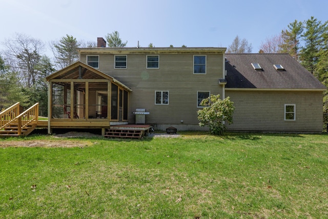 27 Libby Ln, Brunswick, ME 04011 - rear view of property with a chimney, a wooden deck, a sunroom, and a lawn