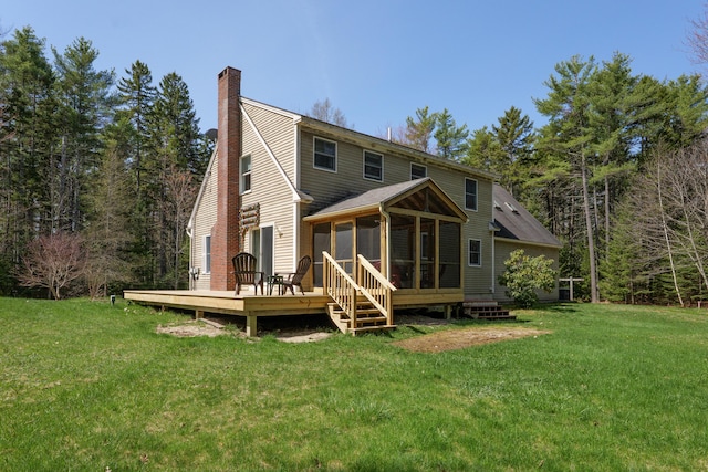 27 Libby Ln, Brunswick, ME 04011 - back of house with a sunroom, a yard, a chimney, and a wooden deck