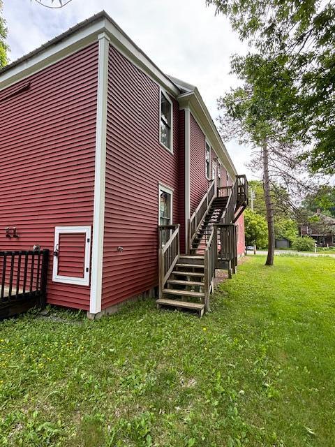 12 Church Rd, Readfield, ME 04355 - view of side of home with stairs, a lawn, and a wooden deck