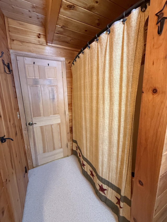 9 Ledge Dr, Greenville, ME 04441 - bathroom featuring wood ceiling, wooden walls, and curtained shower