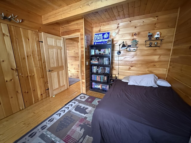 9 Ledge Dr, Greenville, ME 04441 - bedroom featuring wooden walls, wooden ceiling, beam ceiling, and wood-type flooring