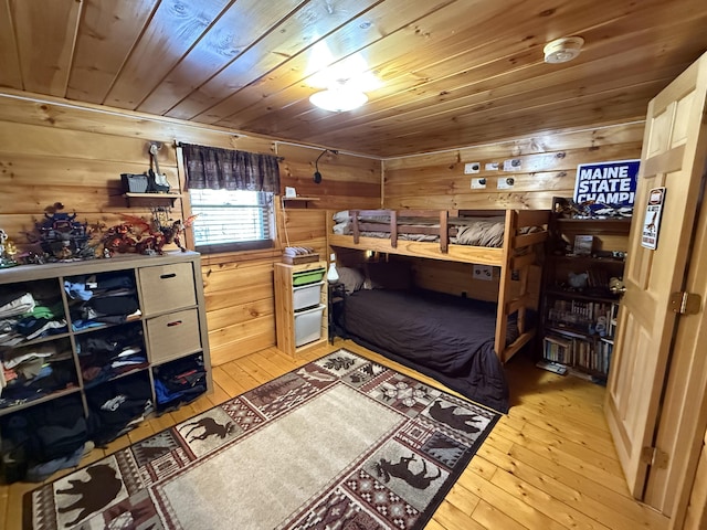 9 Ledge Dr, Greenville, ME 04441 - bedroom with wooden ceiling, light wood finished floors, and wooden walls