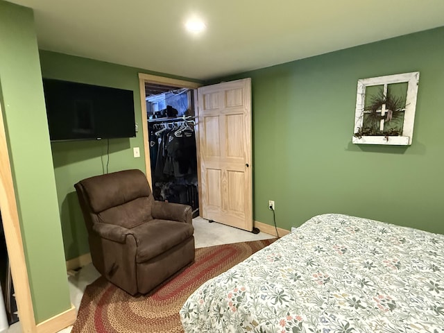 9 Ledge Dr, Greenville, ME 04441 - carpeted bedroom featuring a spacious closet, a closet, and baseboards