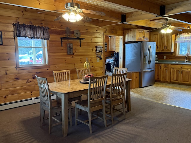 9 Ledge Dr, Greenville, ME 04441 - dining space featuring beamed ceiling, ceiling fan, wood ceiling, wooden walls, and washer / dryer