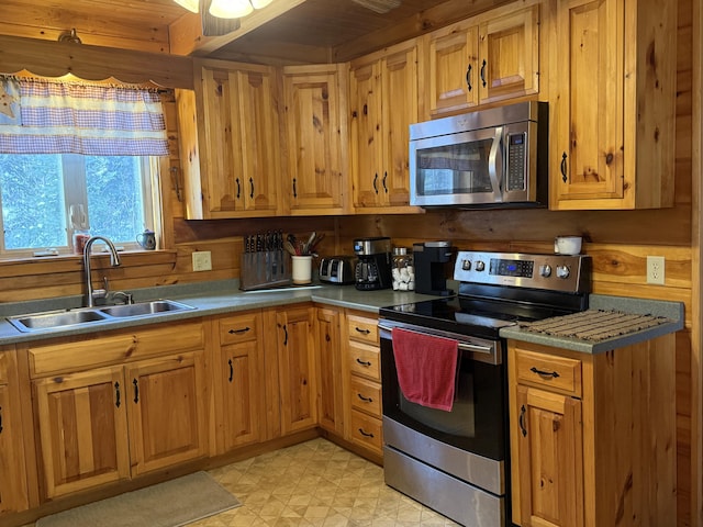 9 Ledge Dr, Greenville, ME 04441 - kitchen with light floors, light countertops, stainless steel appliances, and a sink