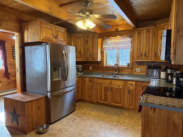 9 Ledge Dr, Greenville, ME 04441 - kitchen featuring wood ceiling, stainless steel appliances, wood walls, and a sink