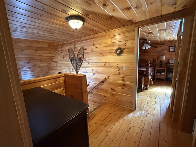 9 Ledge Dr, Greenville, ME 04441 - interior space with wood ceiling, wooden walls, an upstairs landing, and light wood-type flooring