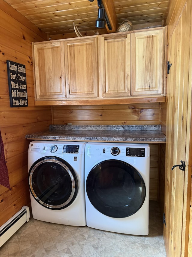 9 Ledge Dr, Greenville, ME 04441 - clothes washing area featuring wood walls, independent washer and dryer, cabinet space, wood ceiling, and a baseboard radiator