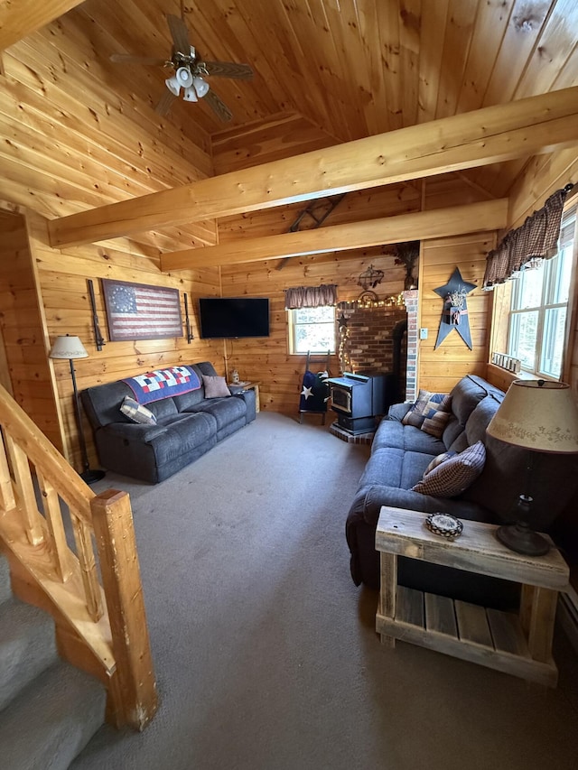 9 Ledge Dr, Greenville, ME 04441 - carpeted living room with wood ceiling, wooden walls, and a healthy amount of sunlight