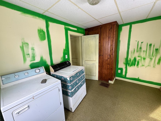 laundry area with laundry area, visible vents, baseboards, and washing machine and clothes dryer