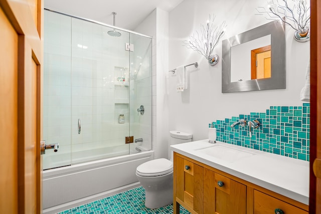 bathroom with tasteful backsplash, a combined bath / shower with rainfall shower, toilet, and vanity