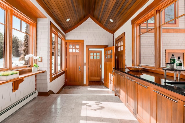 foyer with vaulted ceiling, baseboard heating, light tile patterned flooring, and wood ceiling