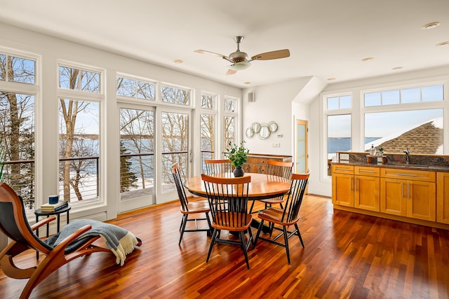 dining area featuring dark wood-type flooring, recessed lighting, a healthy amount of sunlight, and a ceiling fan