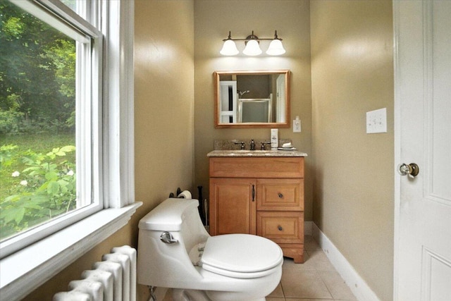 49 Old Village Rd, Winthrop, ME 04364 - bathroom featuring radiator heating unit, vanity, tile patterned floors, and healthy amount of natural light