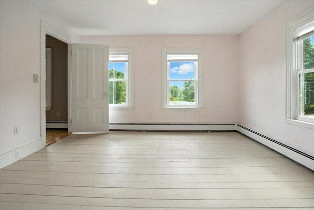 49 Old Village Rd, Winthrop, ME 04364 - unfurnished room with baseboard heating and wood finished floors