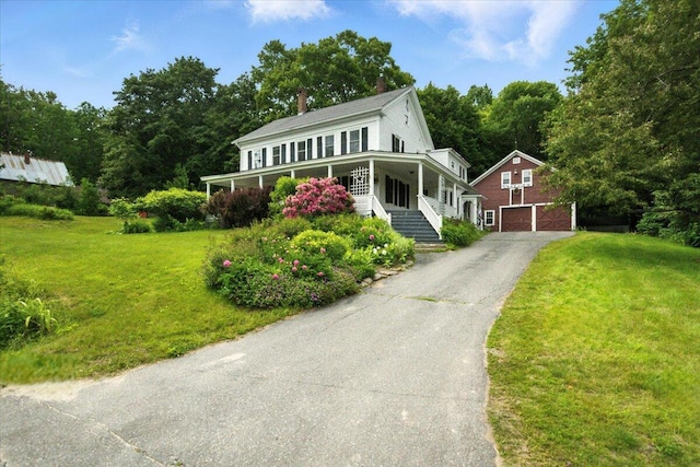 49 Old Village Rd, Winthrop, ME 04364 - farmhouse inspired home with a garage, a chimney, a front yard, and driveway