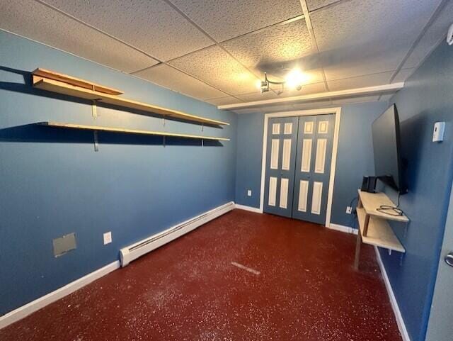 interior space with a baseboard heating unit and baseboards