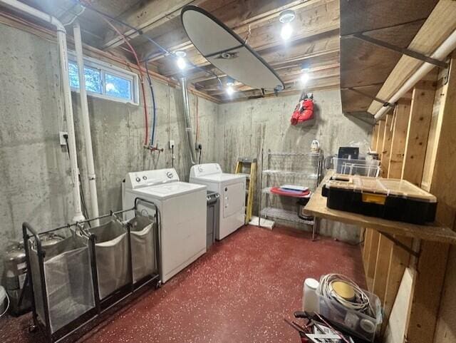 washroom featuring laundry area and washer and dryer