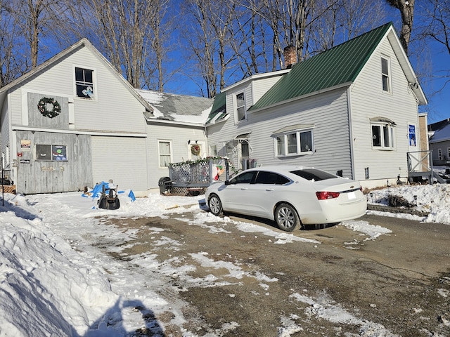21 Water St, Clinton, ME 04927 - exterior space featuring metal roof and a chimney
