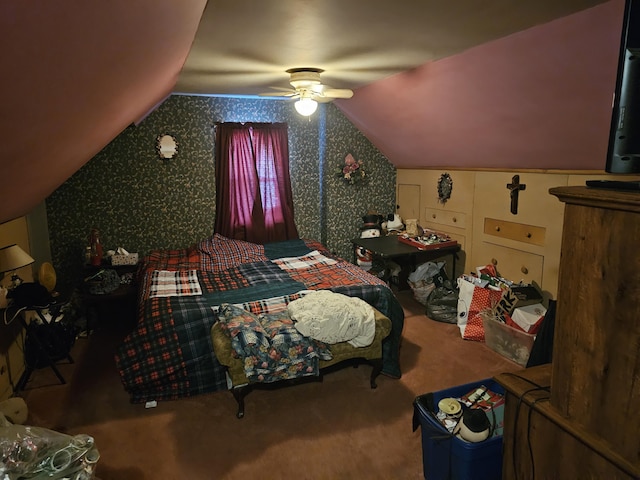 bedroom with ceiling fan, vaulted ceiling, and carpet flooring