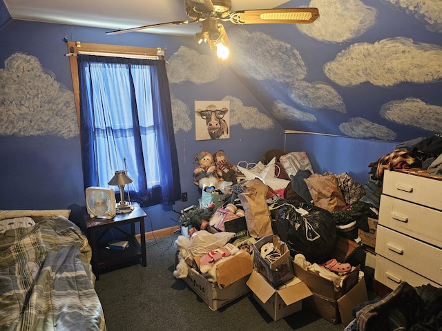 unfurnished bedroom with carpet floors, lofted ceiling, and a ceiling fan