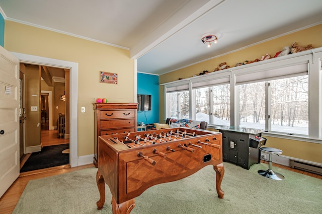 playroom with baseboards, light wood-style flooring, ornamental molding, and a wealth of natural light