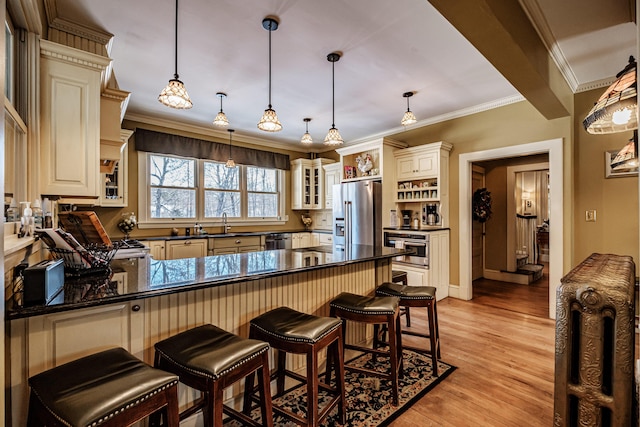 kitchen with stainless steel appliances, hanging light fixtures, open shelves, and glass insert cabinets