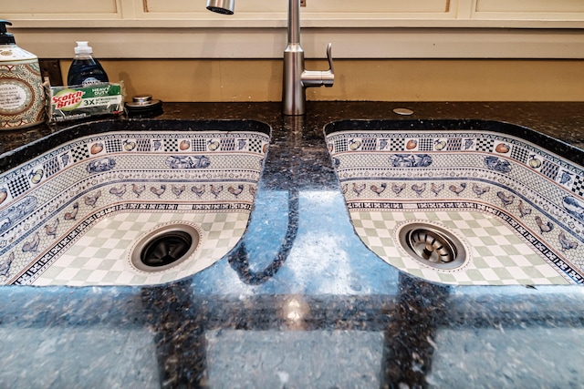 room details featuring dark stone countertops