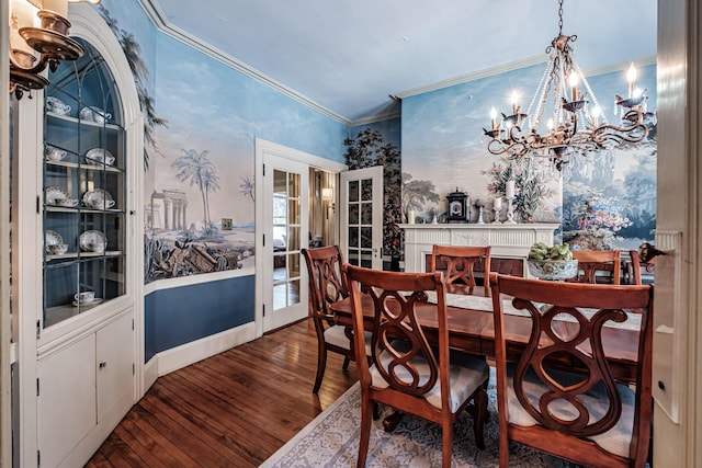 dining area featuring wallpapered walls, dark wood finished floors, ornamental molding, an inviting chandelier, and french doors