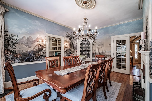 dining room with baseboards, a chandelier, dark wood finished floors, and crown molding