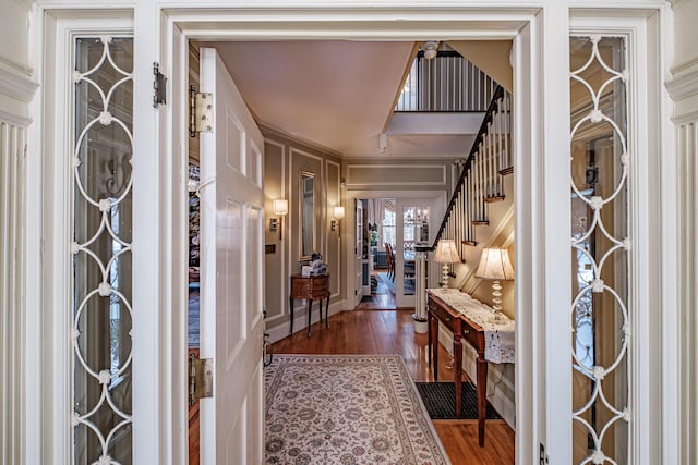 entryway featuring dark wood-style floors and stairway