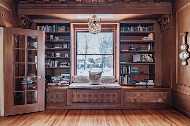 interior space featuring light wood-style flooring and an inviting chandelier