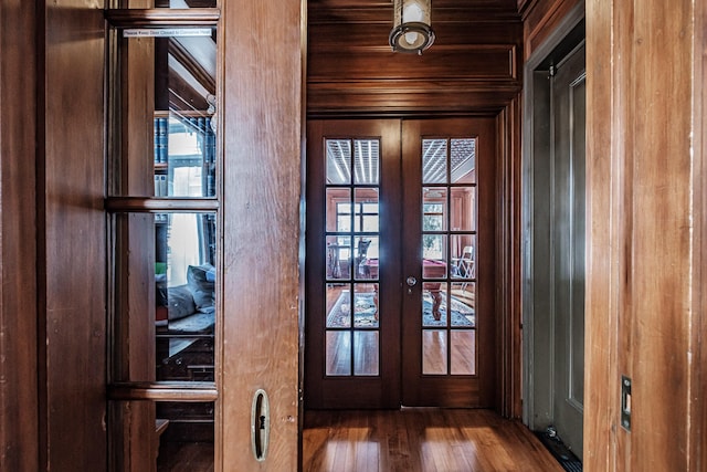 doorway with dark wood-type flooring, french doors, and wooden ceiling