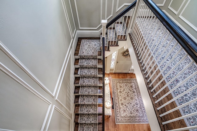 stairs with wood finished floors