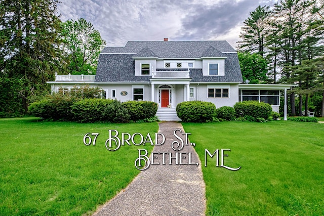 67 Broad St, Bethel, ME 04217 - dutch colonial with roof with shingles, a front lawn, a gambrel roof, a balcony, and a chimney