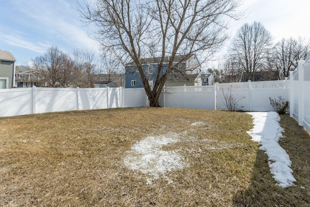 view of yard with a fenced backyard