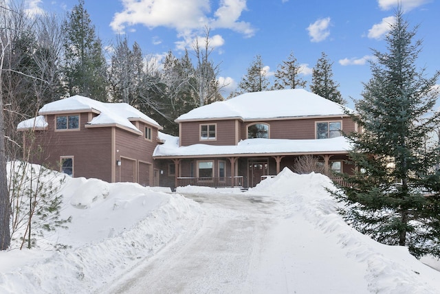 view of front of property featuring covered porch and an attached garage