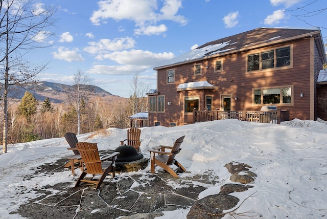 snow covered property with a mountain view