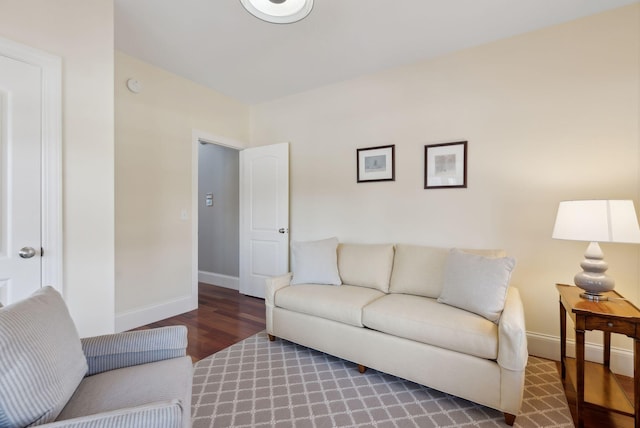 living room featuring wood finished floors and baseboards