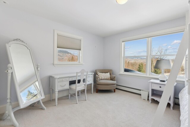 office space featuring light colored carpet and baseboard heating