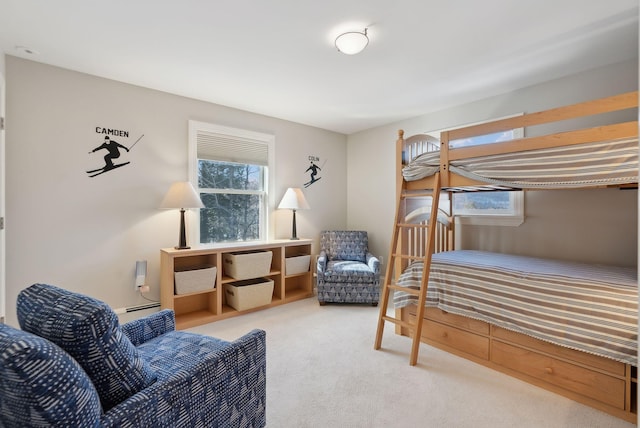 carpeted bedroom with a baseboard radiator