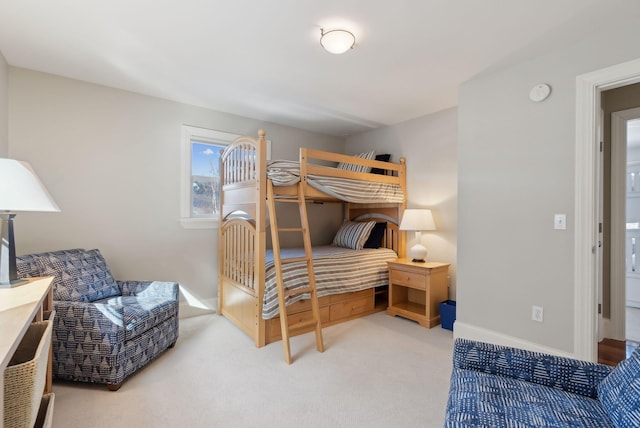 bedroom with carpet and baseboards