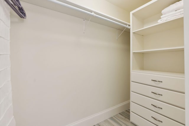 spacious closet with light wood-style floors