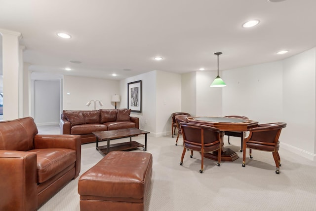 living area with recessed lighting, baseboards, and light colored carpet