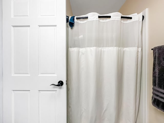 bathroom with a shower with curtain