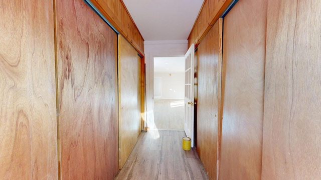 corridor featuring light wood-style floors